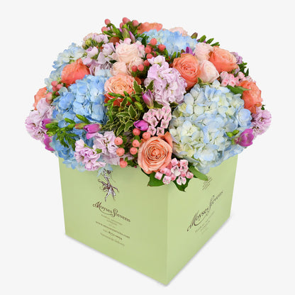 Blue dawn luxury flower bouquet by Moyses Stevens UAE featuring pink bouvardia, hypericum, spray roses, freesias and carnations to make the design truly irresistible