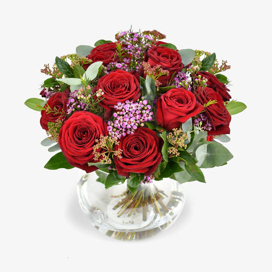 Dozen Red Roses luxury flower bouquet by Moyses Stevens UAE featuring red roses, pink wax flower, skimmia & eucalyptus
